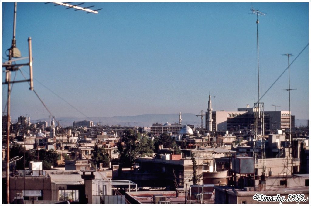 التاريخ السوري المعاصر - دمشـــق 1989 - صورة للمدينة ويظهر فندق المريديان في العمق