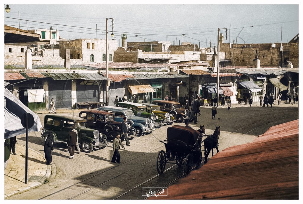 التاريخ السوري المعاصر - صور تاريخية ملونة - سيارات أمام مبنى النافعية قرب باب الفرج في حلب 1937
